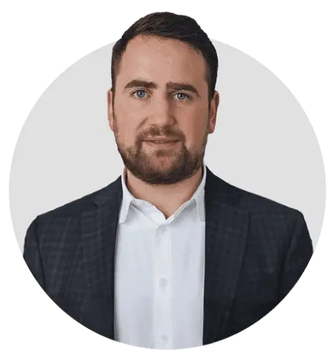 Male professional in a suit, representing expertise in solar energy solutions.