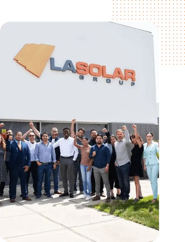LA Solar Group team standing outside the office, celebrating their achievements.